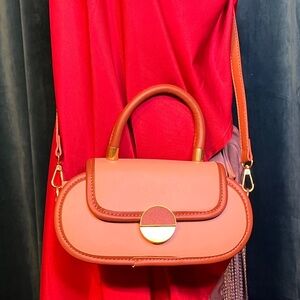 Brown Pleater Mini Bag with Crossbody Strap and Single Handle